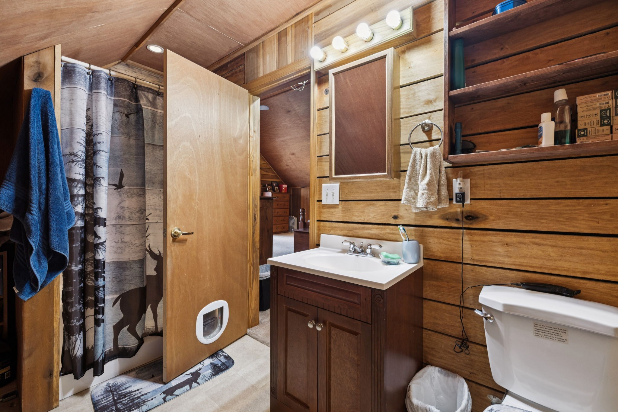 176 Robert Hensley Road Hohenwald, TN 38462 - Photo 37 of 87 a bathroom with a sink toilet vanity and shower