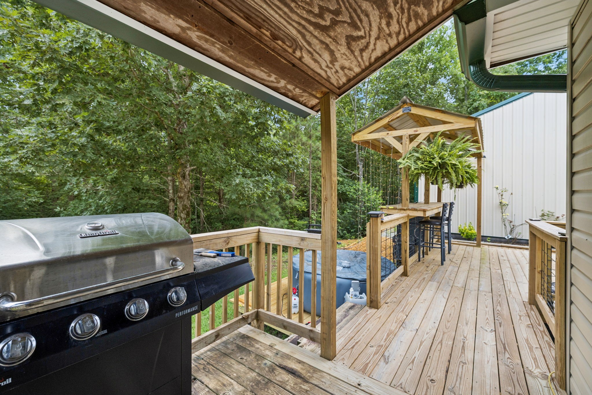 176 Robert Hensley Road Hohenwald, TN 38462 - Photo 56 of 87 a view of a deck with wooden floor and outer view