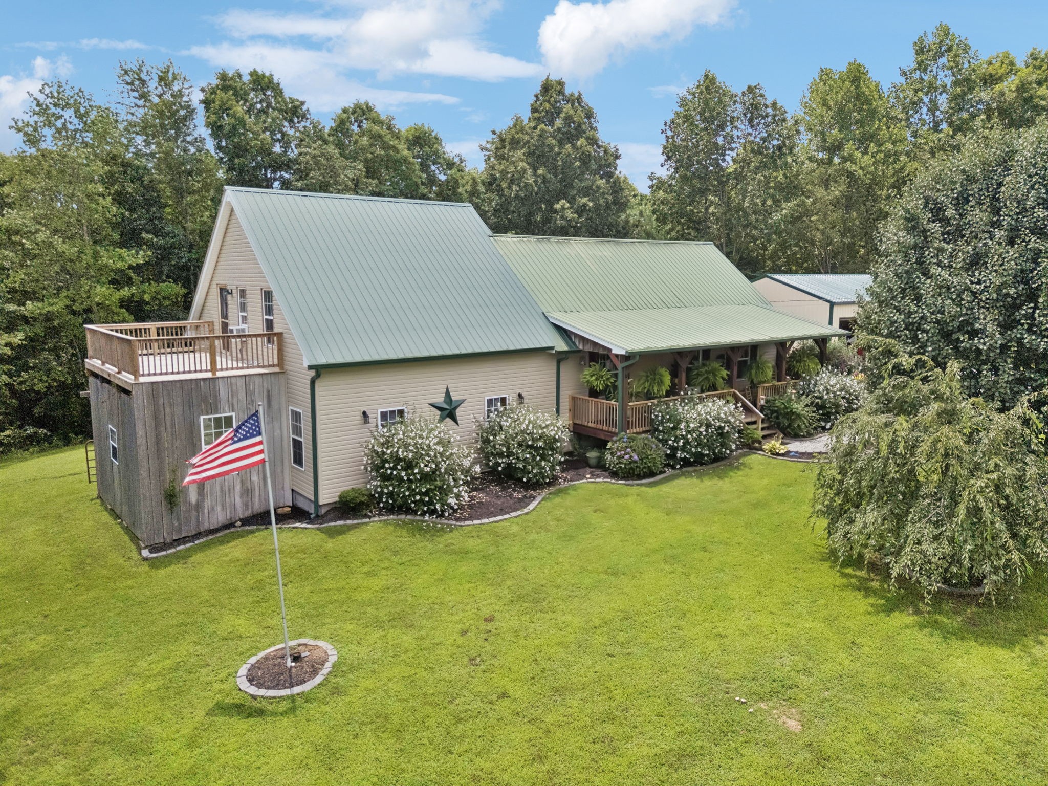 176 Robert Hensley Road Hohenwald, TN 38462 - Photo 60 of 87 a backyard of a house with yard and outdoor seating