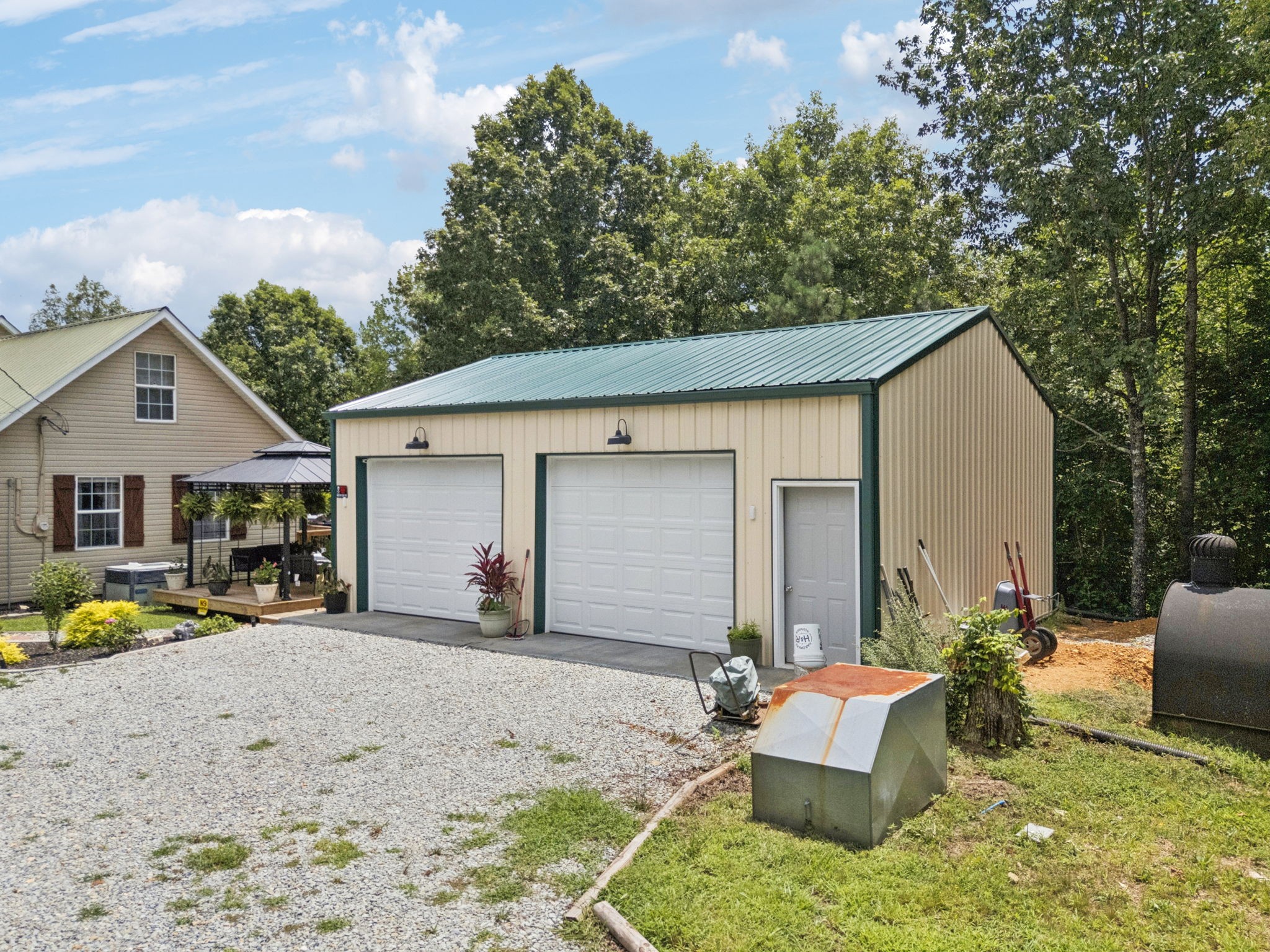 176 Robert Hensley Road Hohenwald, TN 38462 - Photo 65 of 87 a front view of house with yard outdoor seating and barbeque oven