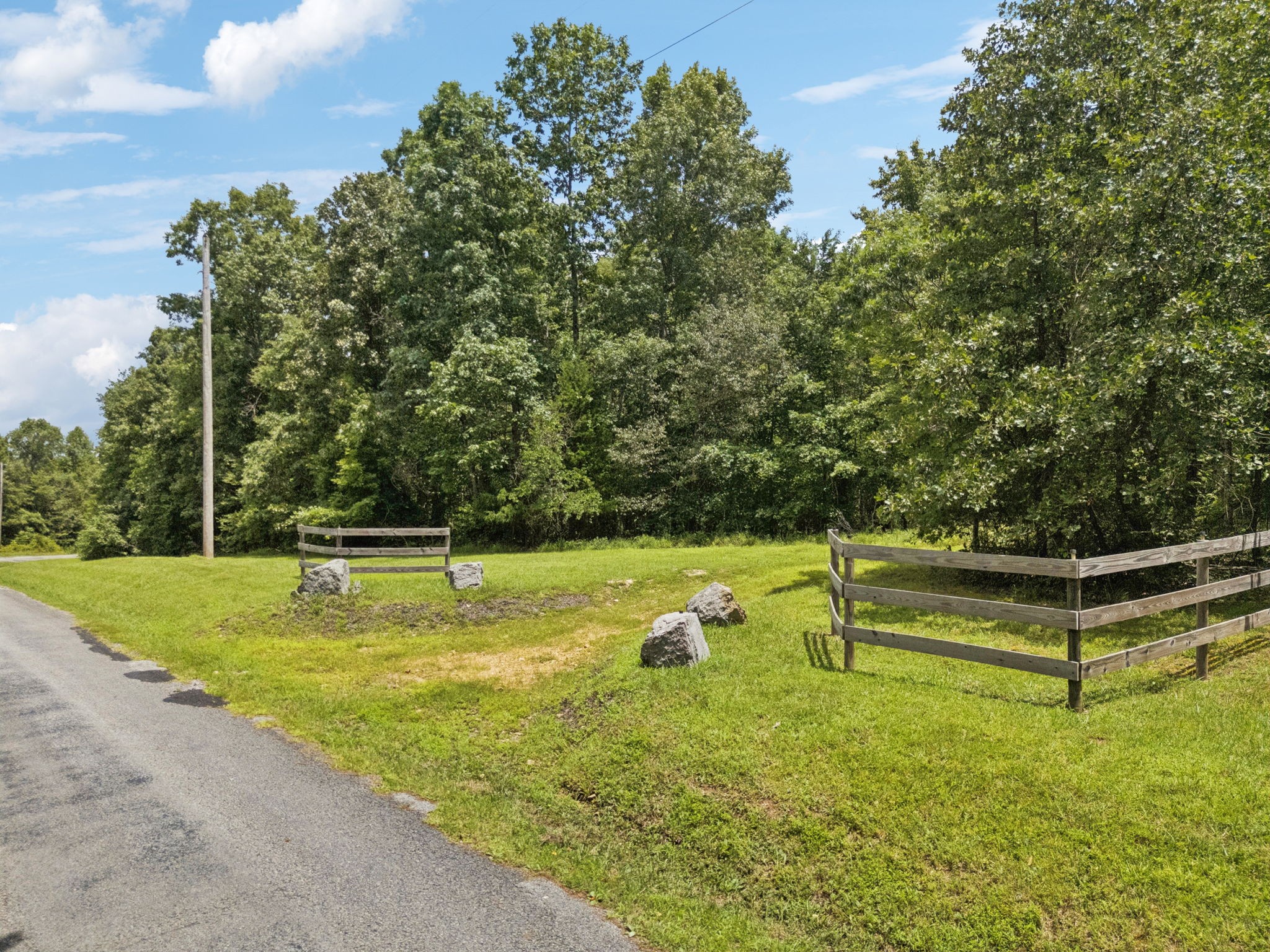 176 Robert Hensley Road Hohenwald, TN 38462 - Photo 72 of 87 a view of a swimming pool with a yard