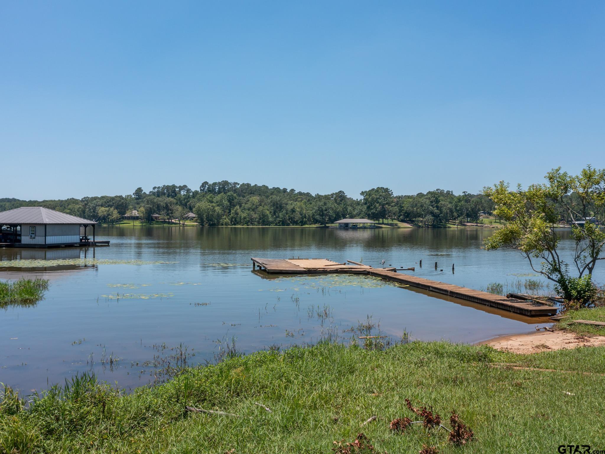 15606 McElroy Road Whitehouse, TX 75791 - Photo 15 of 37 a view of a lake with houses