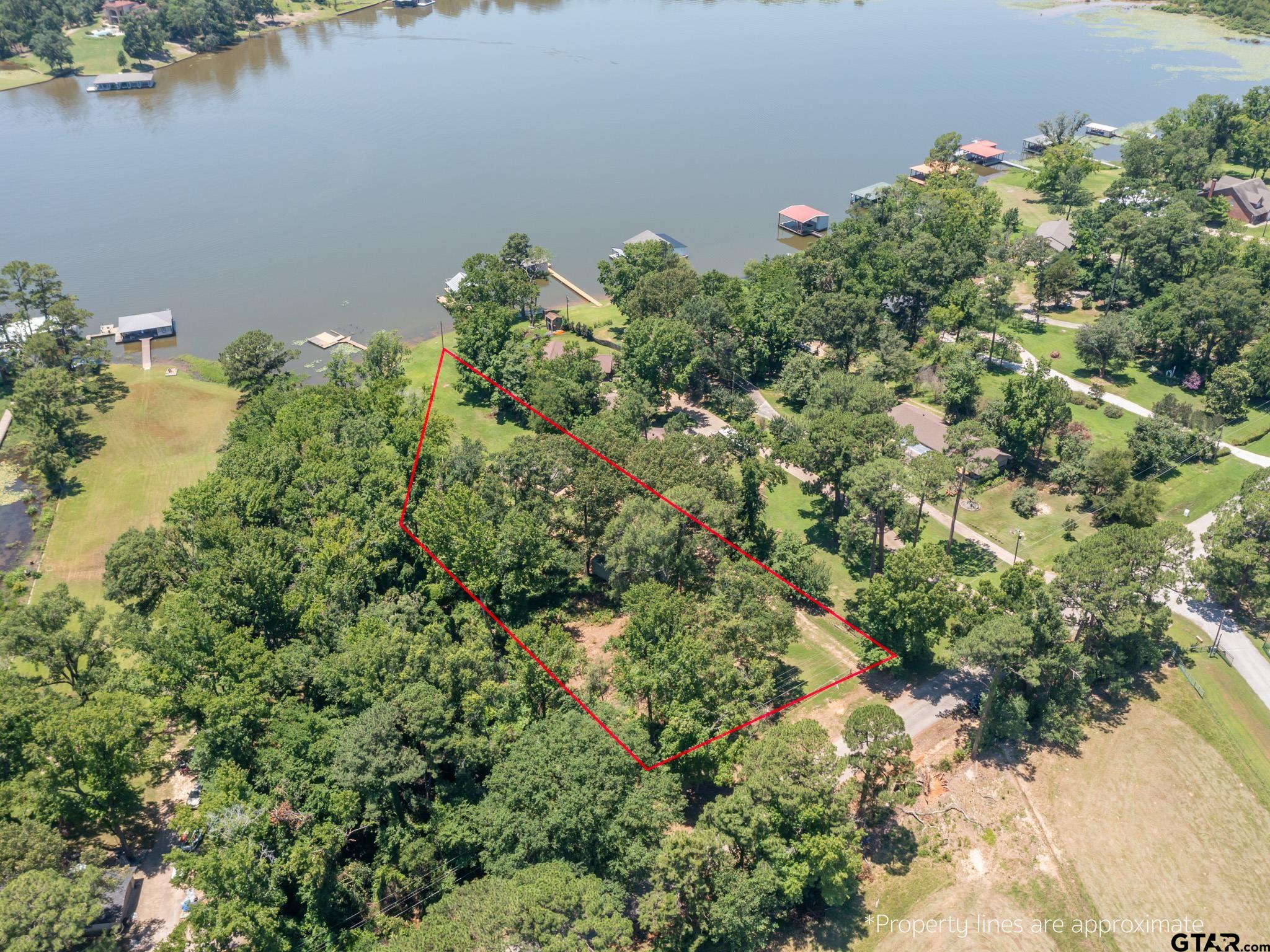 15606 McElroy Road Whitehouse, TX 75791 - Photo 16 of 37 an aerial view of a house with a yard and lake view
