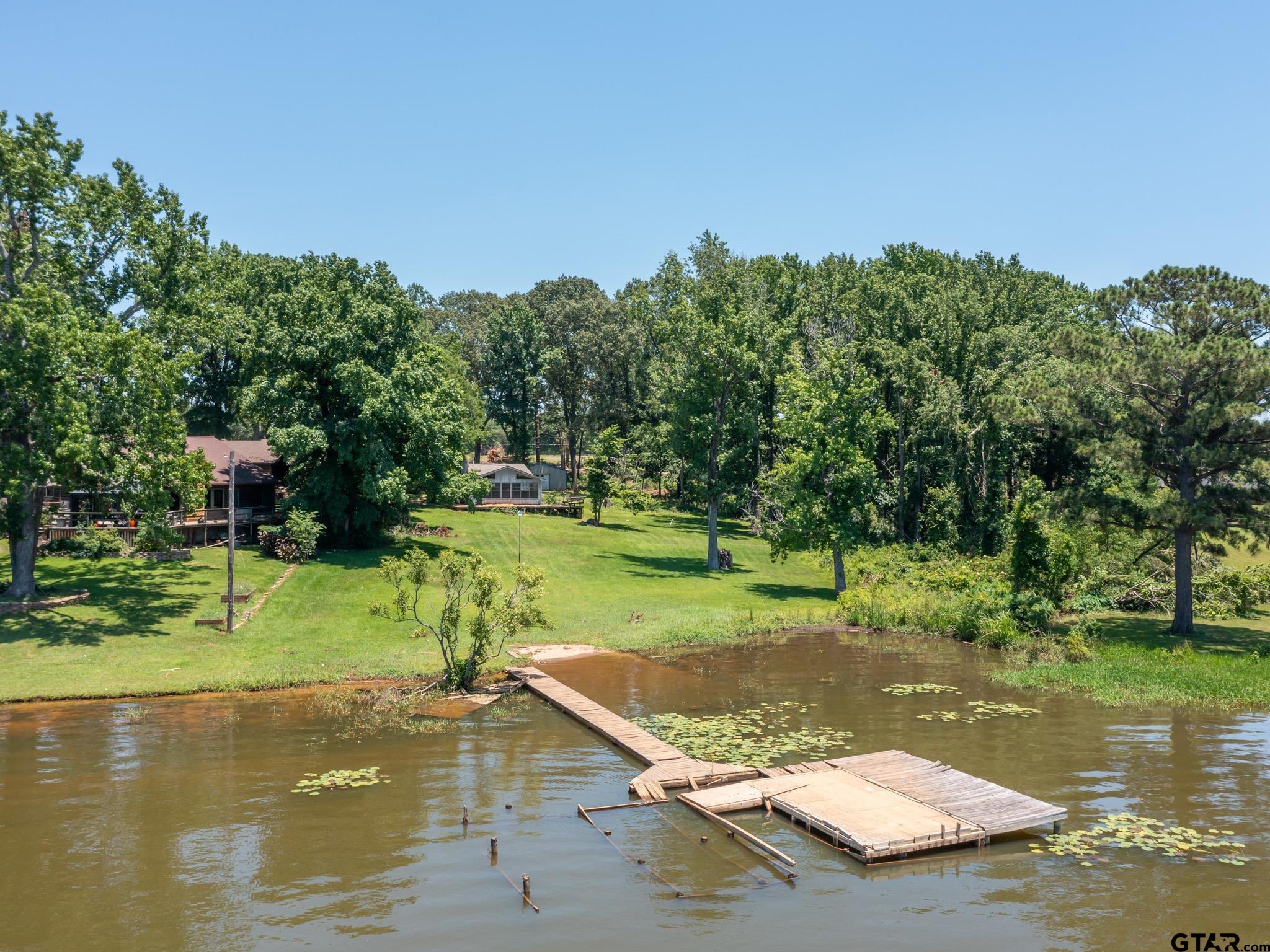 15606 McElroy Road Whitehouse, TX 75791 - Photo 20 of 37 a view of a golf course with a lake