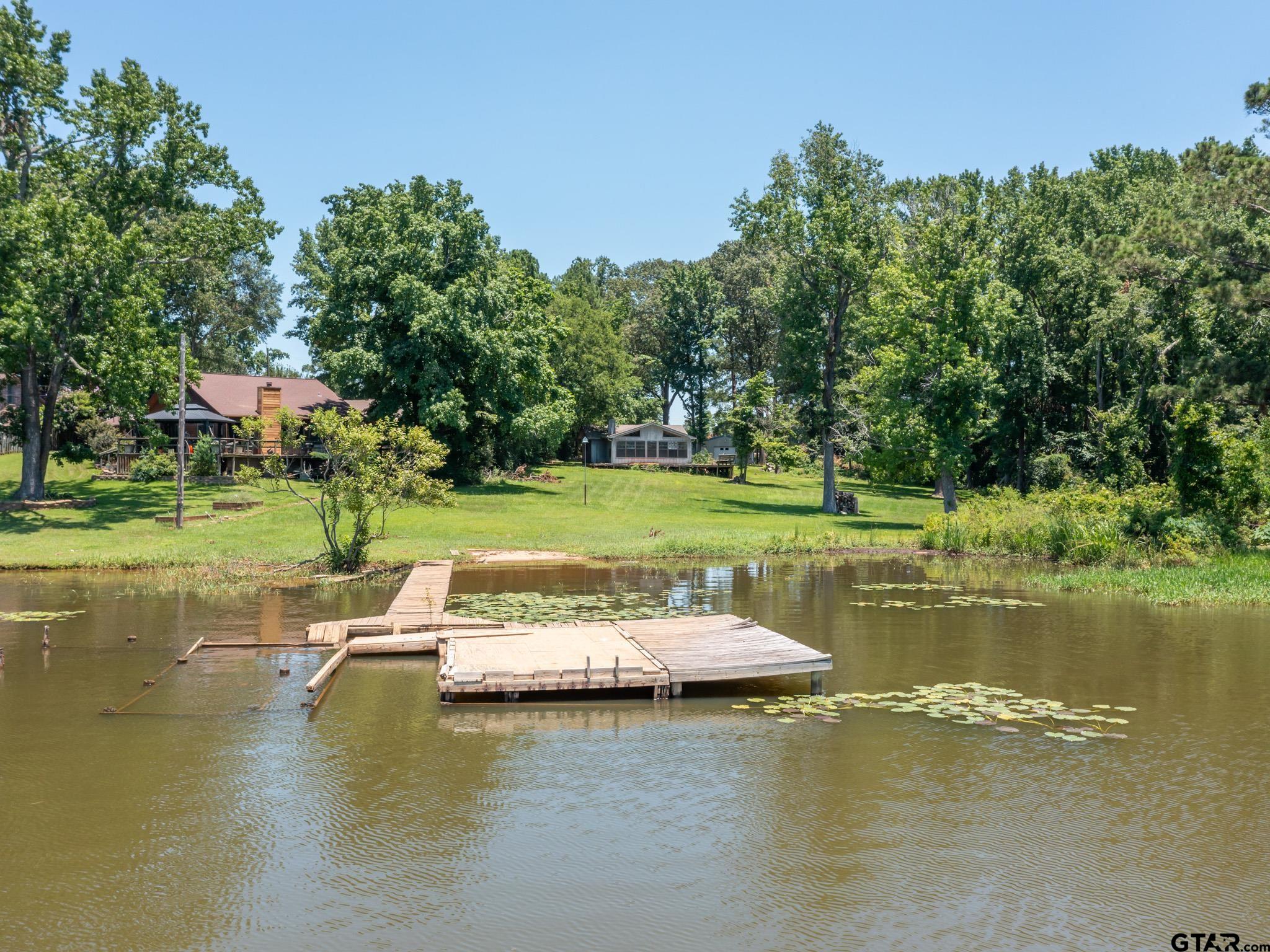 15606 McElroy Road Whitehouse, TX 75791 - Photo 21 of 37 a view of a lake with houses in background