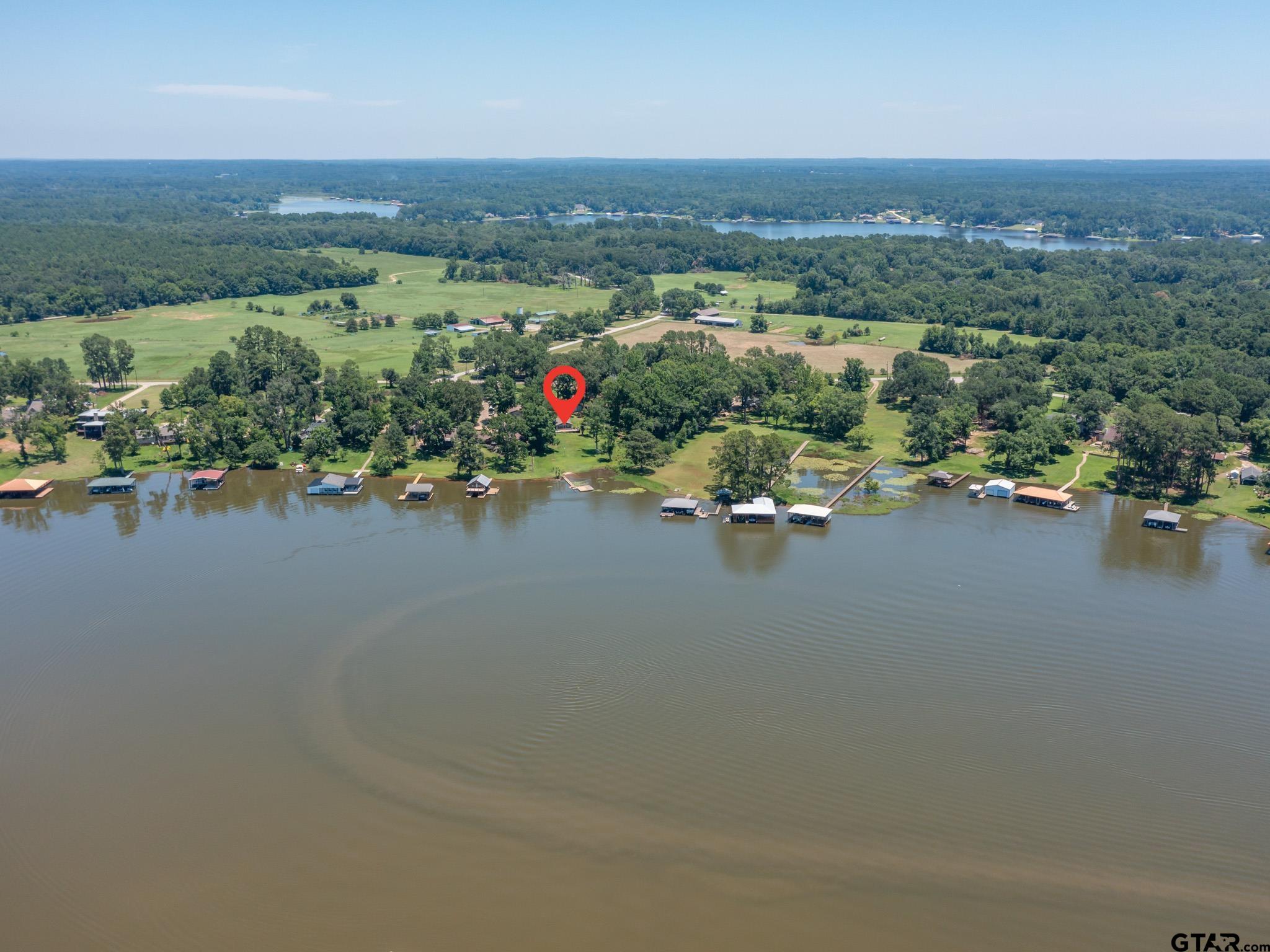 15606 McElroy Road Whitehouse, TX 75791 - Photo 4 of 37 an aerial view of a houses with a road and a lake view