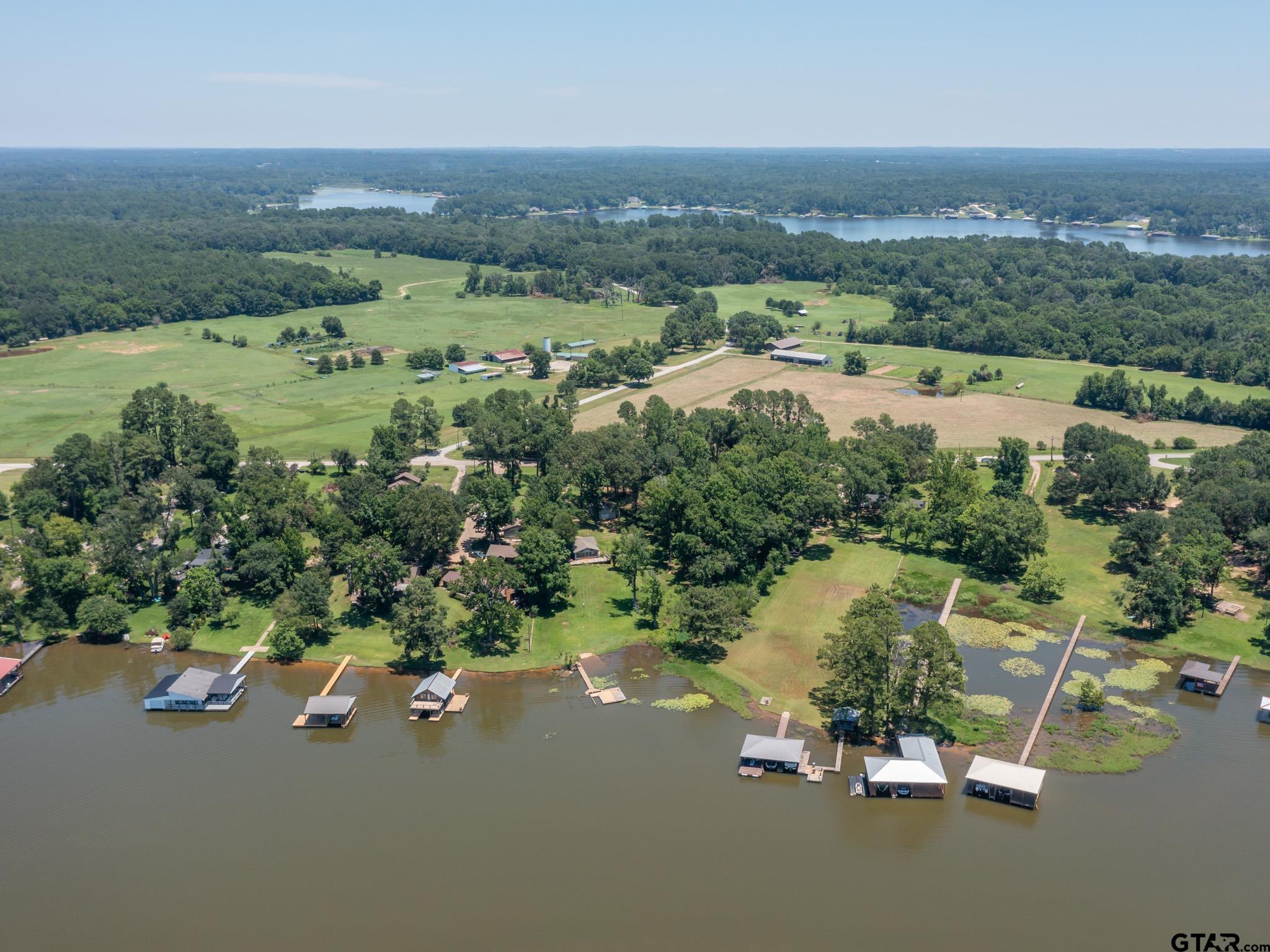 15606 McElroy Road Whitehouse, TX 75791 - Photo 6 of 37 an aerial view of lake and residential houses with outdoor space