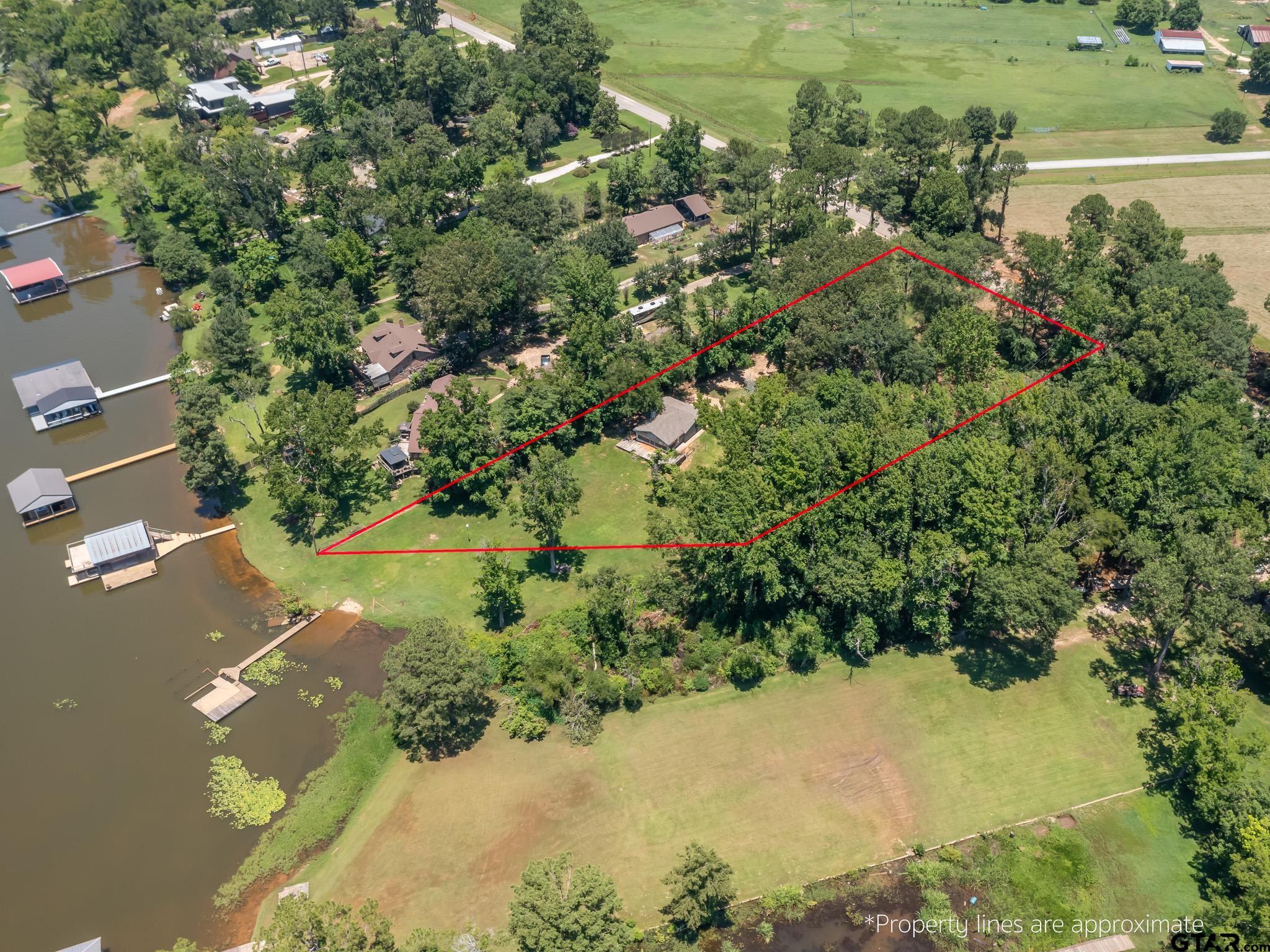 15606 McElroy Road Whitehouse, TX 75791 - Photo 7 of 37 a view of a lake with a yard