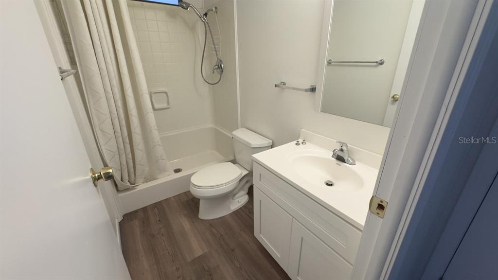 10928 Federal Drive Port Richey, FL 34668 - Photo 9 of 12 a bathroom with a sink toilet and shower