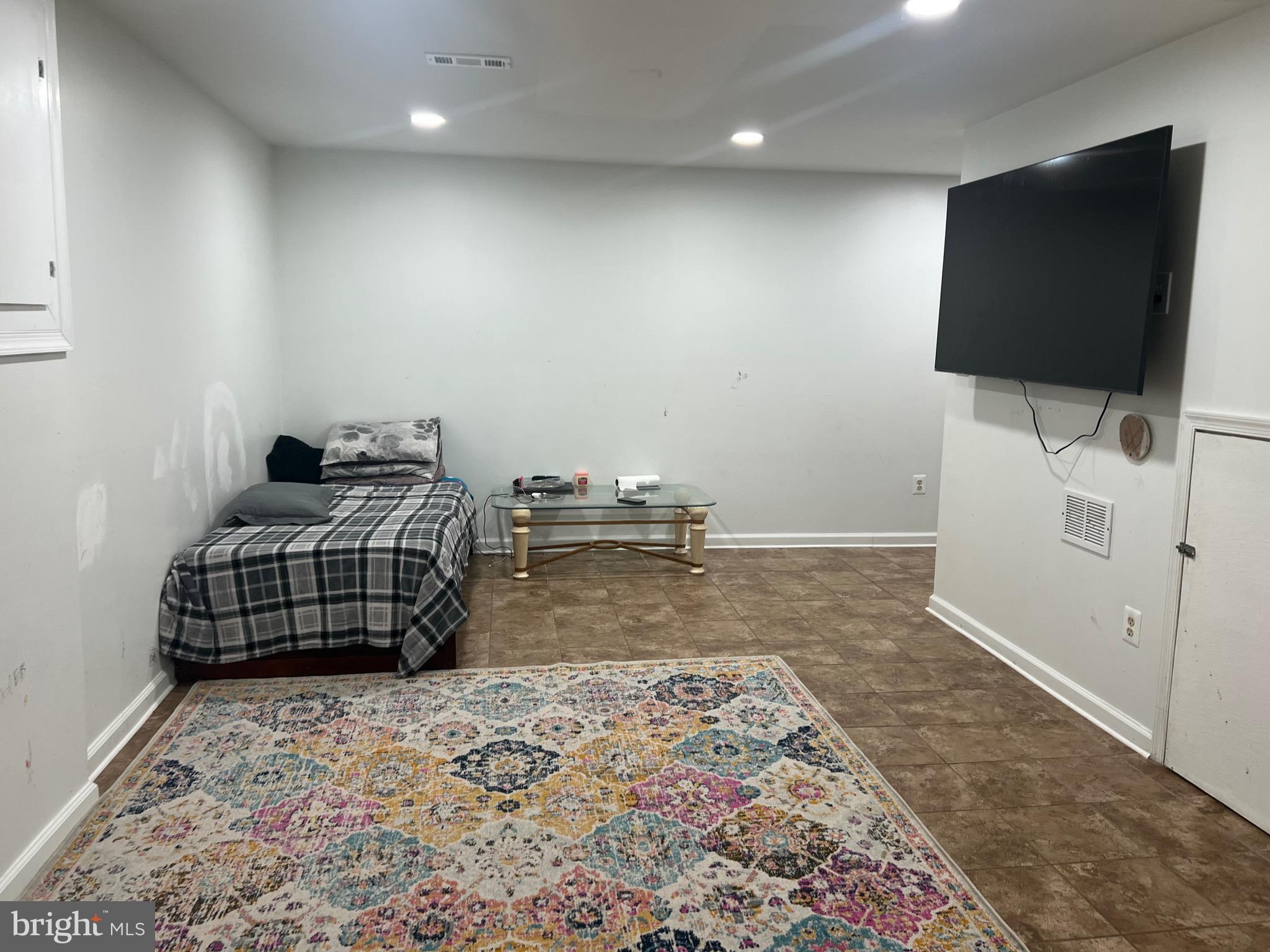 15704 Beau Ridge Drive Woodbridge, VA 22193 - Photo 15 of 26 a bedroom with a bed and a flat screen tv