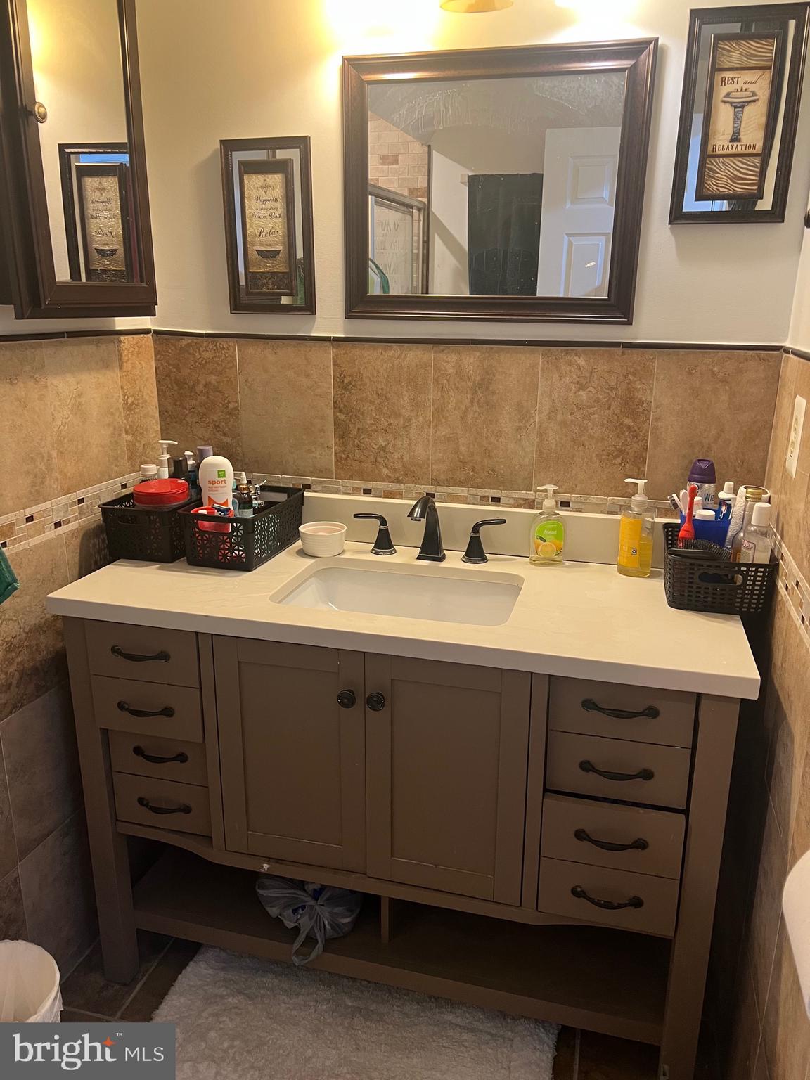 15704 Beau Ridge Drive Woodbridge, VA 22193 - Photo 20 of 26 a bathroom with a sink and a mirror
