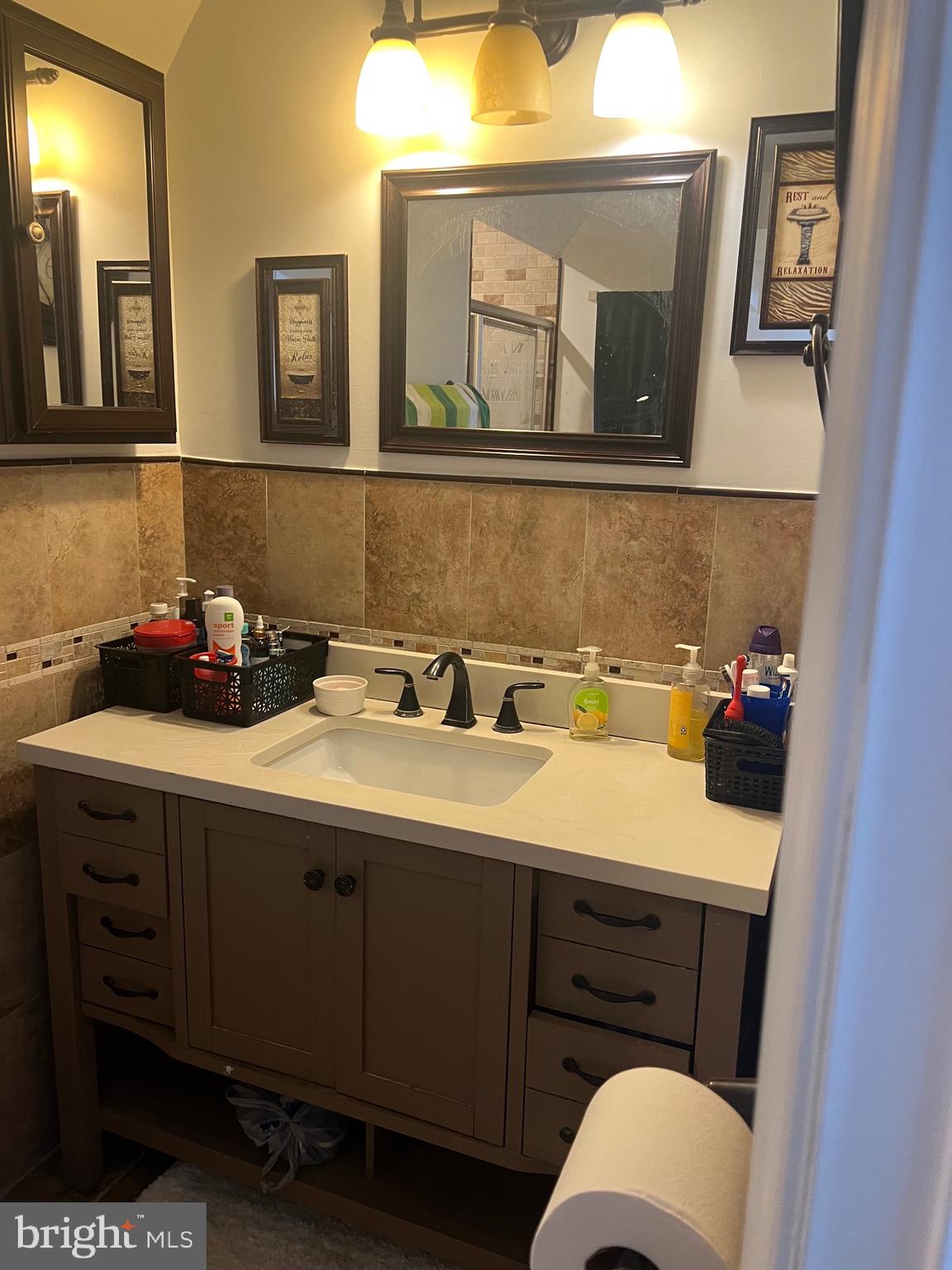 15704 Beau Ridge Drive Woodbridge, VA 22193 - Photo 22 of 26 a bathroom with a sink mirror and toilet