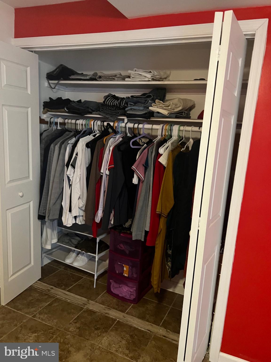 15704 Beau Ridge Drive Woodbridge, VA 22193 - Photo 24 of 26 a view of walk in closet with clothes and shoes
