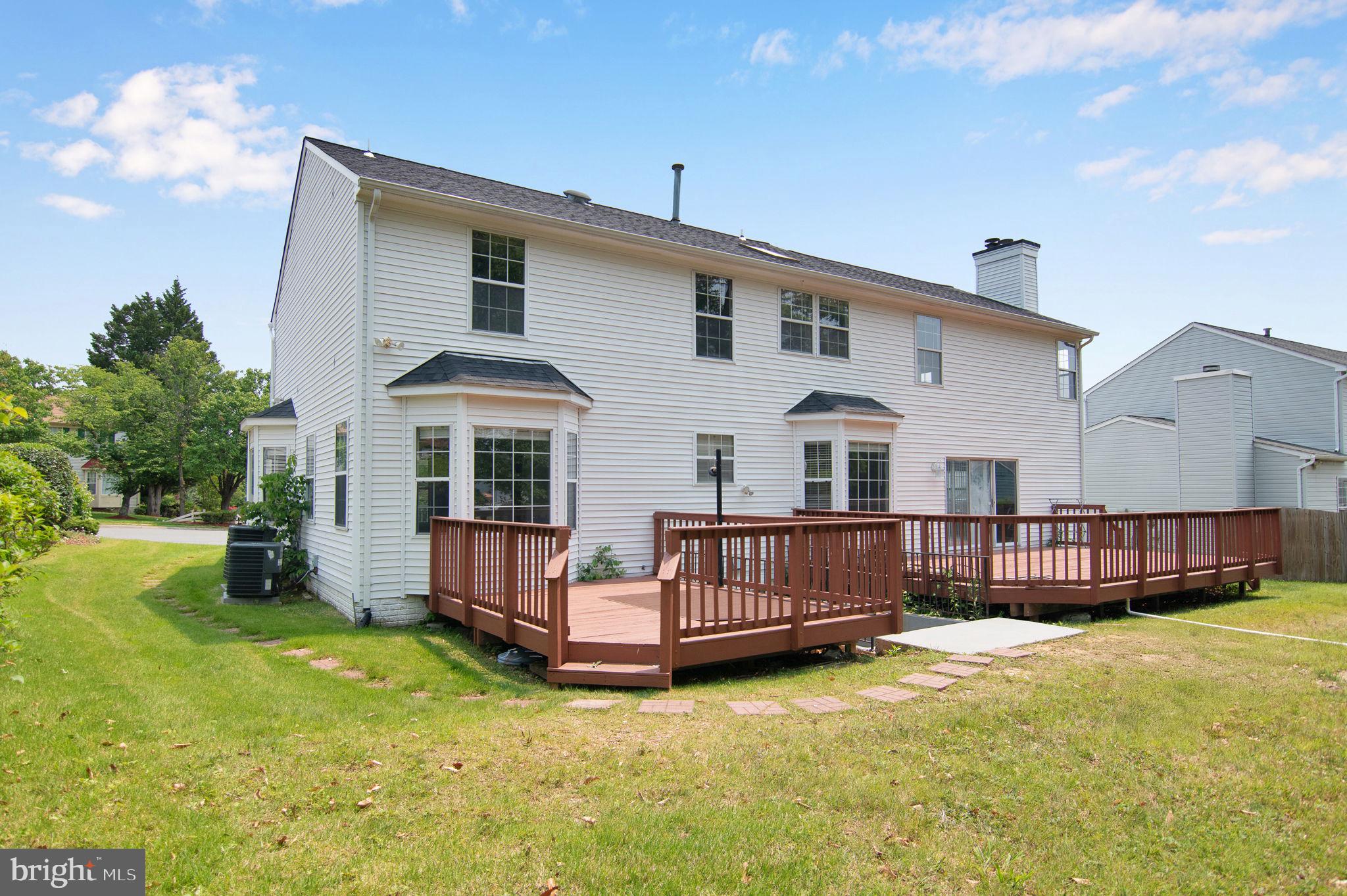 15704 Beau Ridge Drive Woodbridge, VA 22193 - Photo 5 of 26 a front view of a house with garden