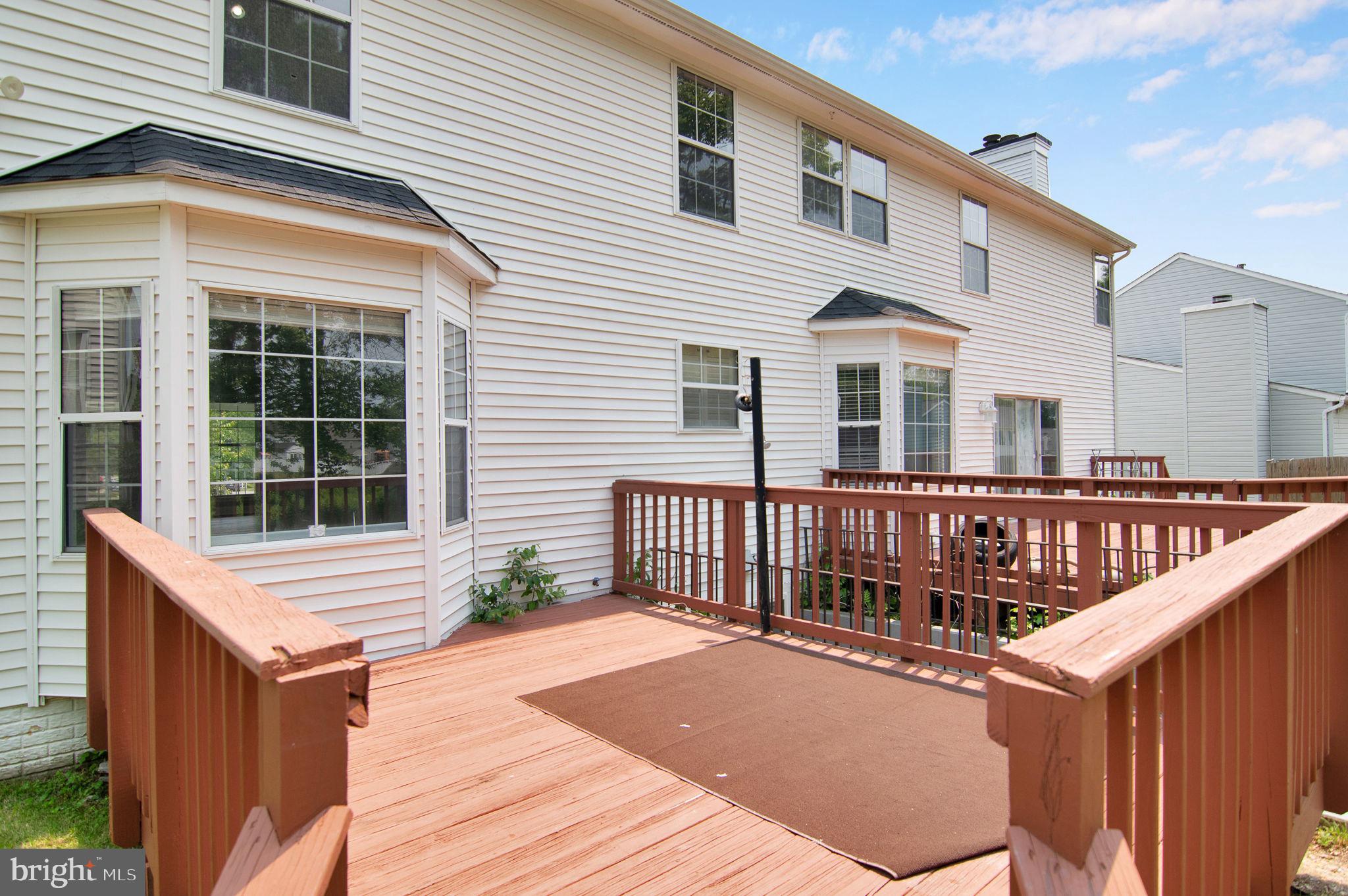 15704 Beau Ridge Drive Woodbridge, VA 22193 - Photo 9 of 26 a front view of a house with large windows
