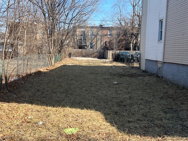 7041 South Aberdeen Street Chicago, IL 60621 - Photo 2 of 2 a view of yard covered with snow in front of house
