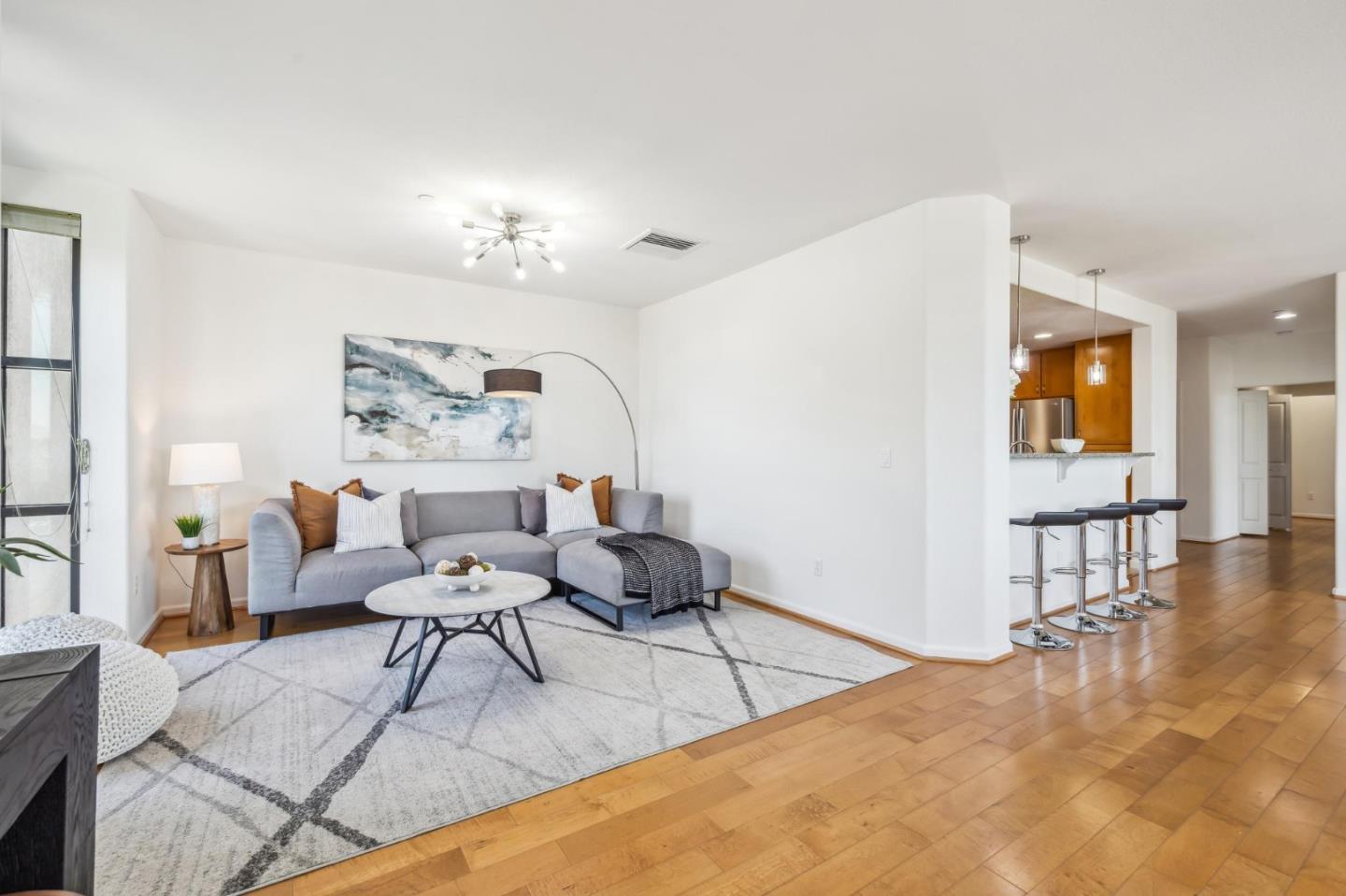 1388 Broadway, Unit 209 Millbrae, CA 94030 - Photo 11 of 40 a living room with furniture and wooden floor