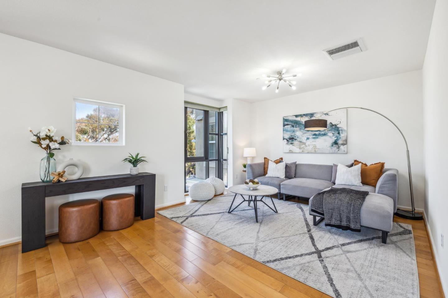 1388 Broadway, Unit 209 Millbrae, CA 94030 - Photo 12 of 40 a living room with furniture a fireplace and a potted plant