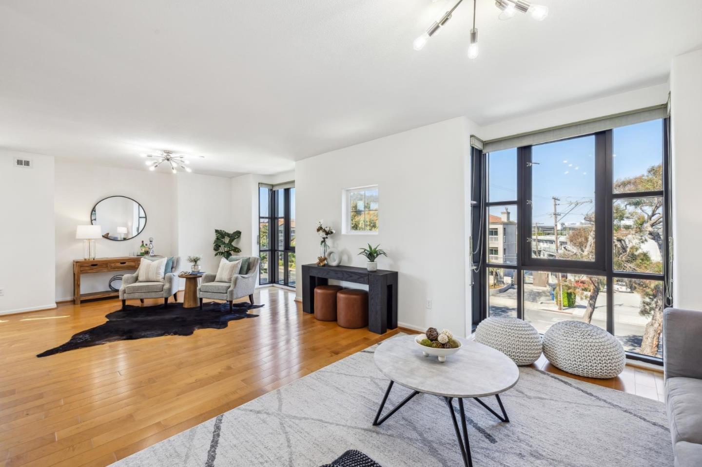1388 Broadway, Unit 209 Millbrae, CA 94030 - Photo 14 of 40 a living room with furniture and a large window
