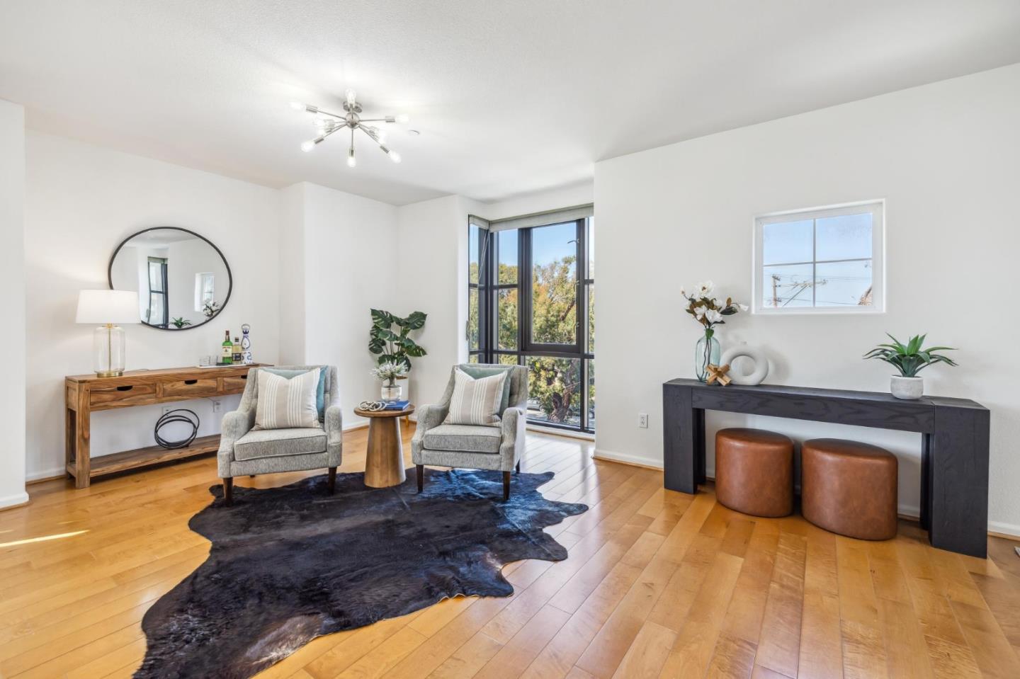 1388 Broadway, Unit 209 Millbrae, CA 94030 - Photo 15 of 40 a living room with furniture and a fireplace