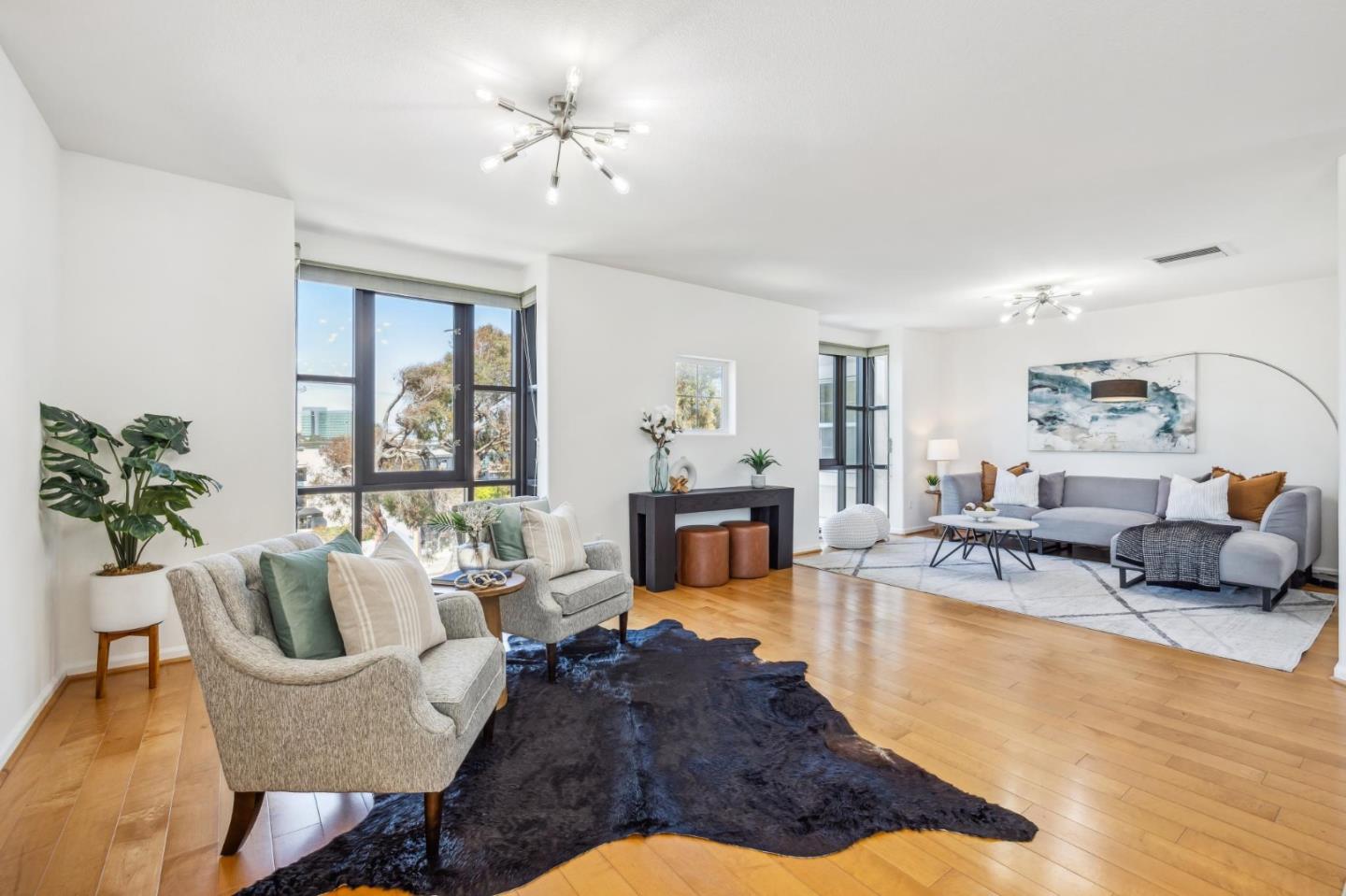 1388 Broadway, Unit 209 Millbrae, CA 94030 - Photo 16 of 40 a living room with furniture and a fireplace