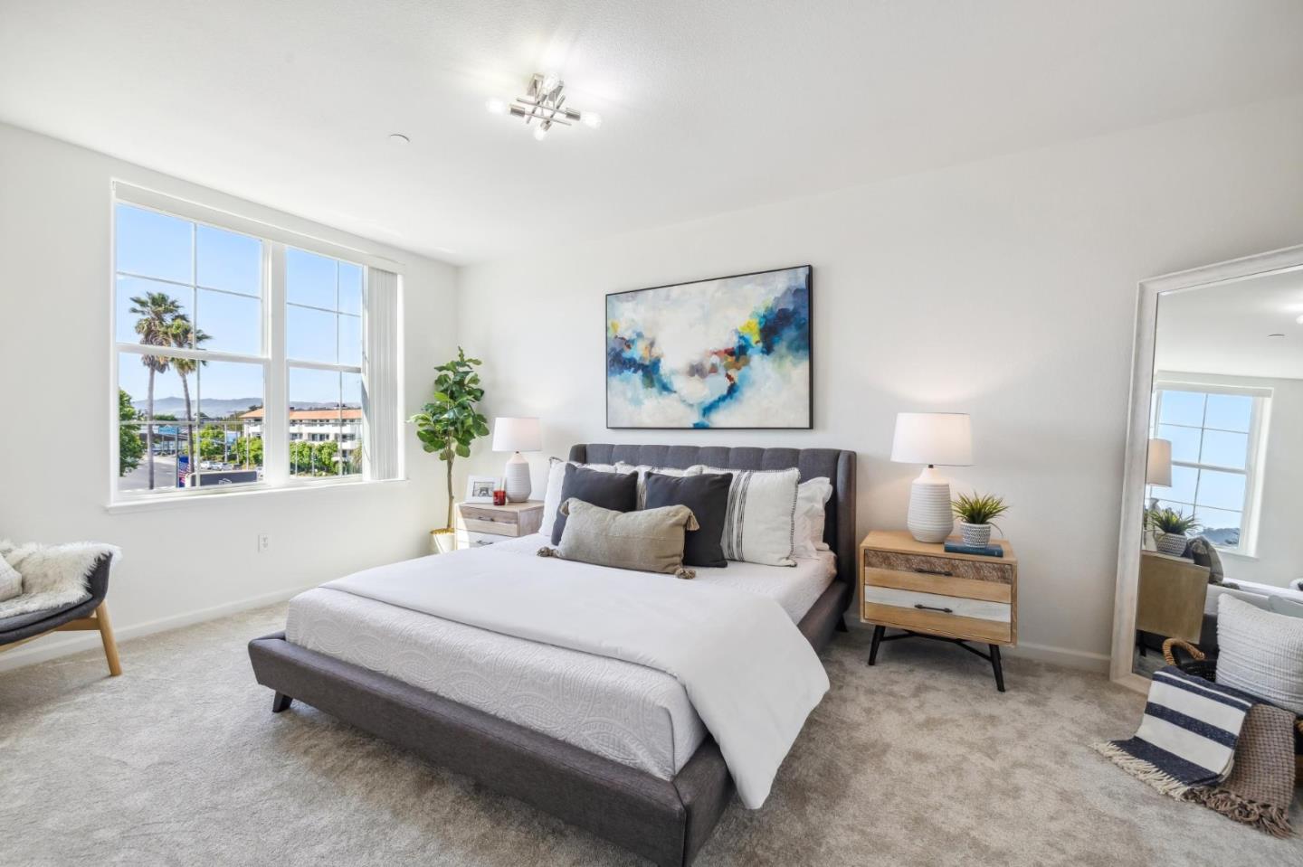 1388 Broadway, Unit 209 Millbrae, CA 94030 - Photo 17 of 40 a bedroom with a bed and a painting on the wall