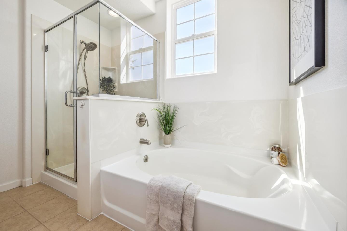 1388 Broadway, Unit 209 Millbrae, CA 94030 - Photo 23 of 40 a bathroom with a tub and shower