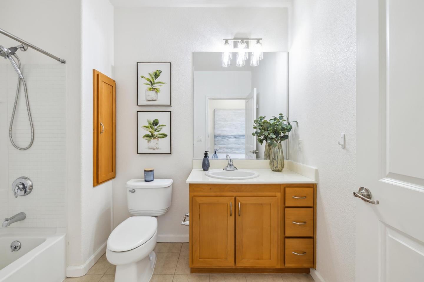 1388 Broadway, Unit 209 Millbrae, CA 94030 - Photo 27 of 40 a bathroom with a sink toilet and shower