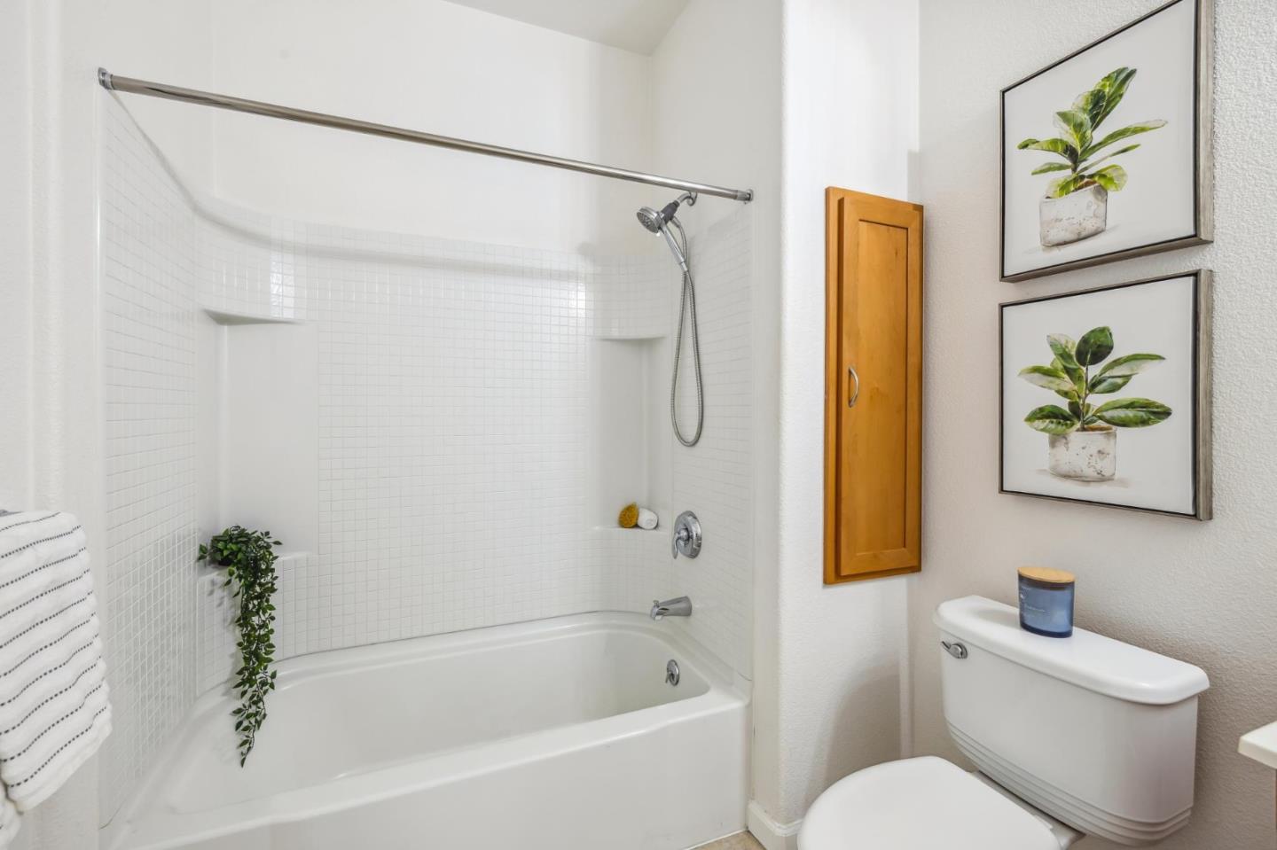 1388 Broadway, Unit 209 Millbrae, CA 94030 - Photo 28 of 40 a white toilet sitting next to a bath tub