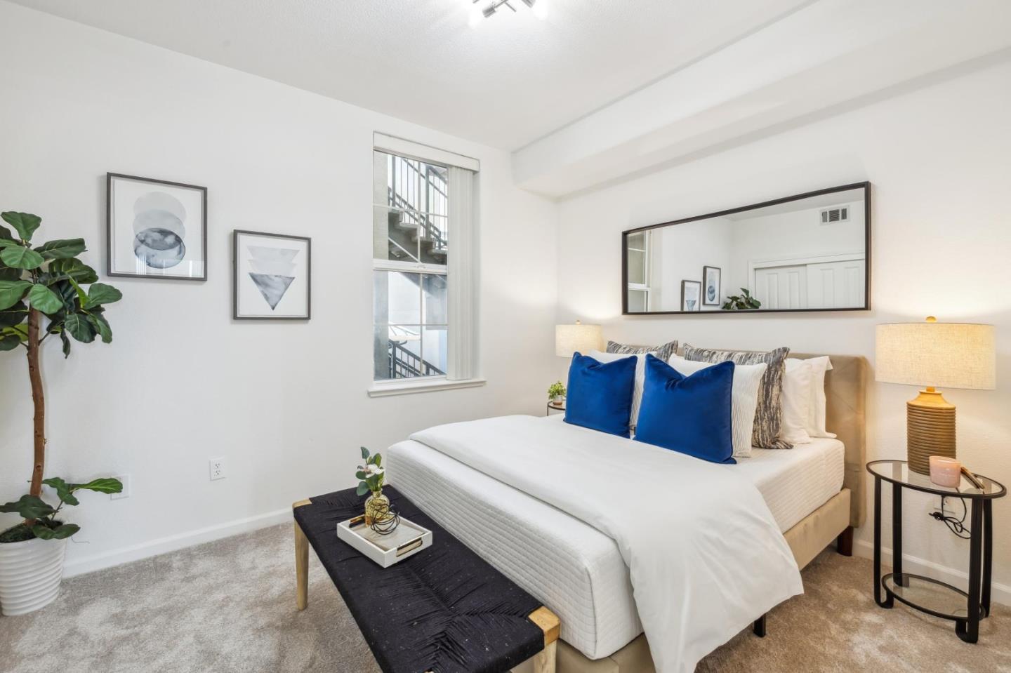 1388 Broadway, Unit 209 Millbrae, CA 94030 - Photo 29 of 40 a bedroom with a bed and a potted plant