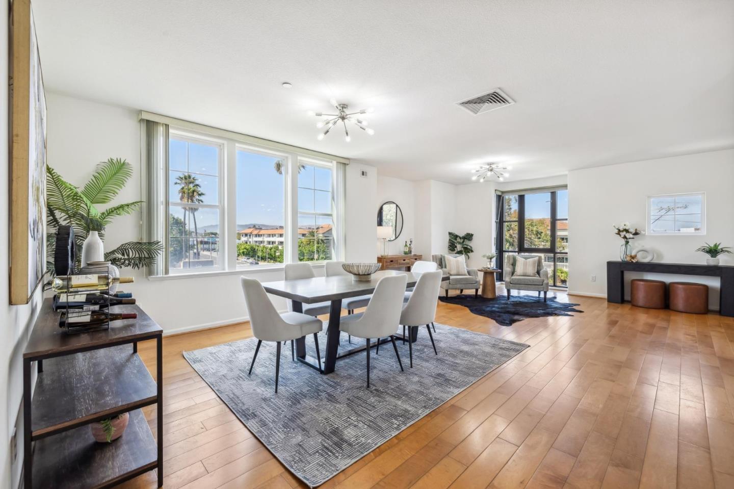 1388 Broadway, Unit 209 Millbrae, CA 94030 - Photo 3 of 40 a view of a dining room with furniture and wooden floor