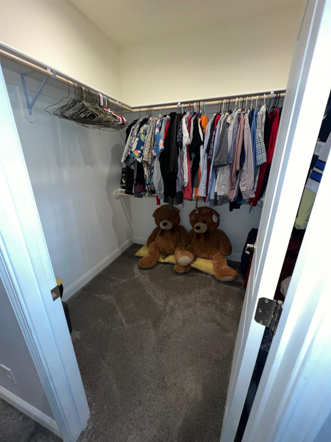 889 Coloma Place Madera, CA 93637 - Photo 37 of 61 a view of walk in closet with clothes and shoes