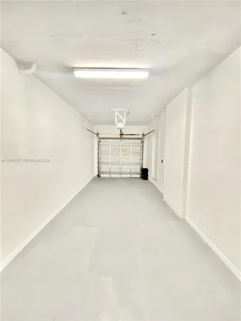 a view of a hallway with stairs