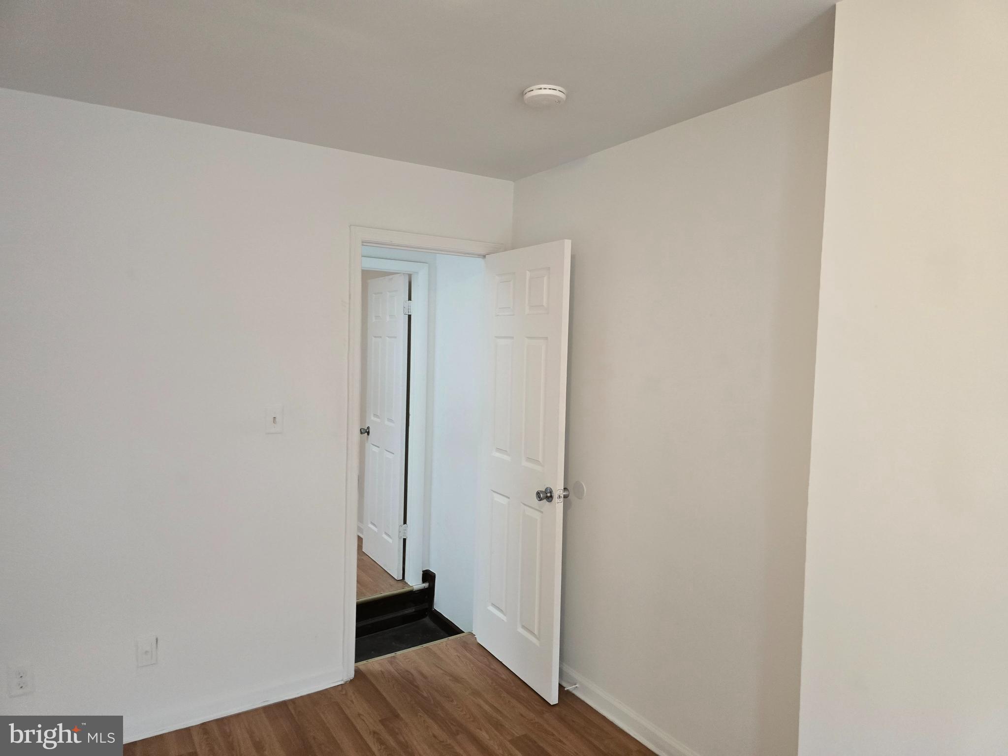 2418 Etting Street Baltimore, MD 21217 - Photo 14 of 24 a view of a hallway with wooden floor