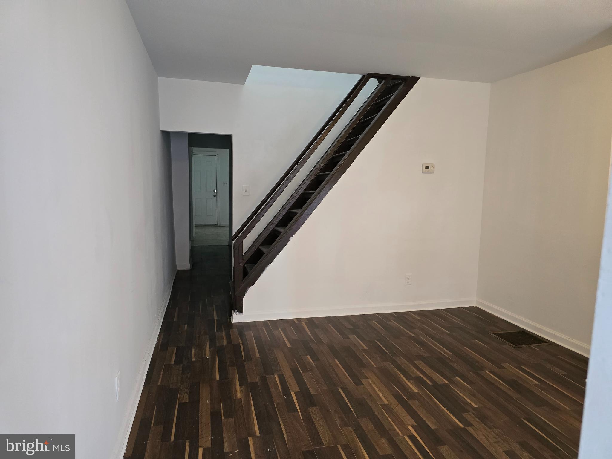 2418 Etting Street Baltimore, MD 21217 - Photo 3 of 24 a view of a hallway with wooden floor and staircase
