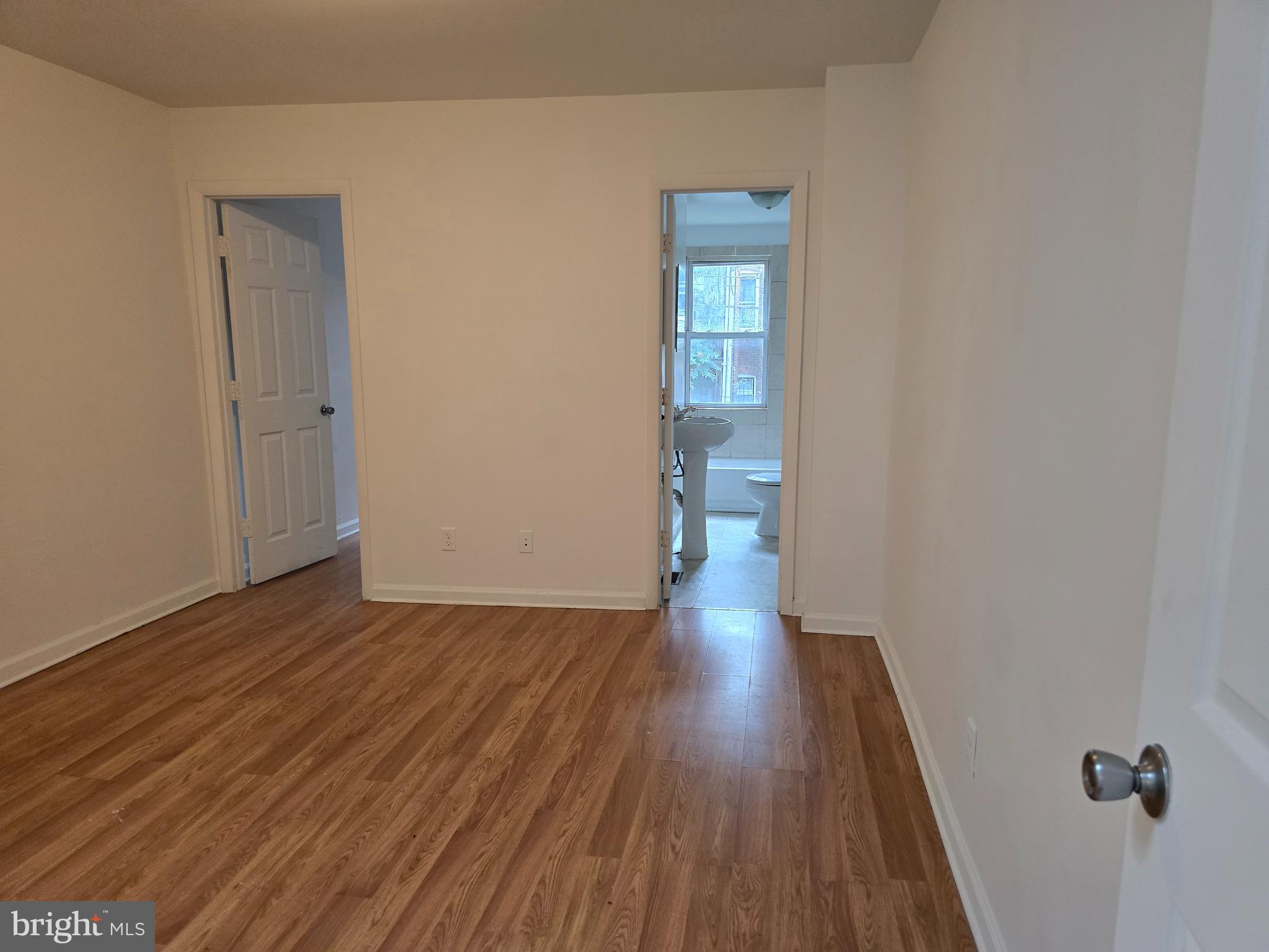 2418 Etting Street Baltimore, MD 21217 - Photo 8 of 24 a view of a hallway with wooden floor