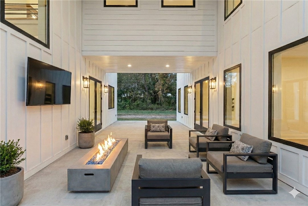 112 Rosa Dorsey Ln Street St. Simons Island, GA 31522 - Photo 30 of 44 Virtually staged outdoor seating option 2 w/ outdoor gas fireplace feature