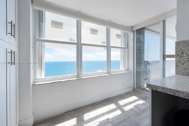 a view of an empty room with a window