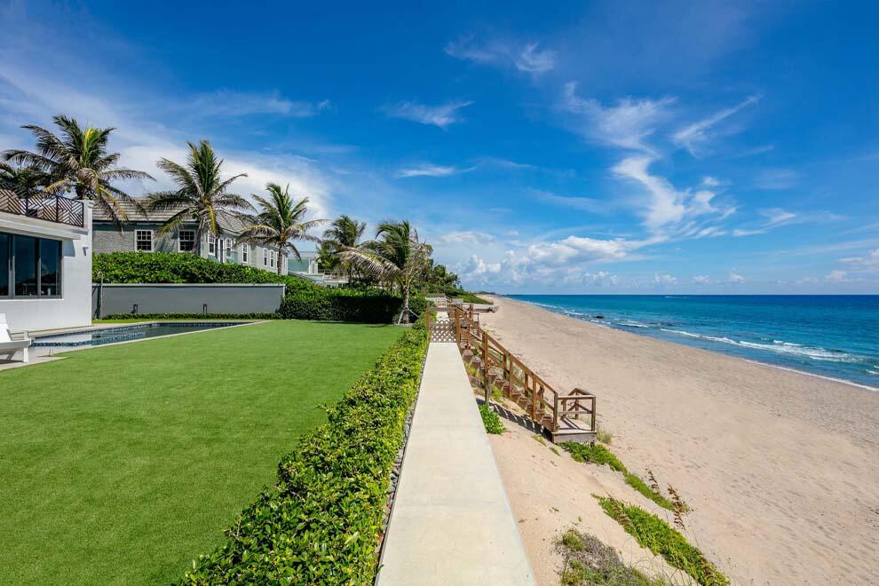 6029 Old Ocean Boulevard Ocean Ridge, FL 33435 - Photo 2 of 13 a view of an ocean with a garden