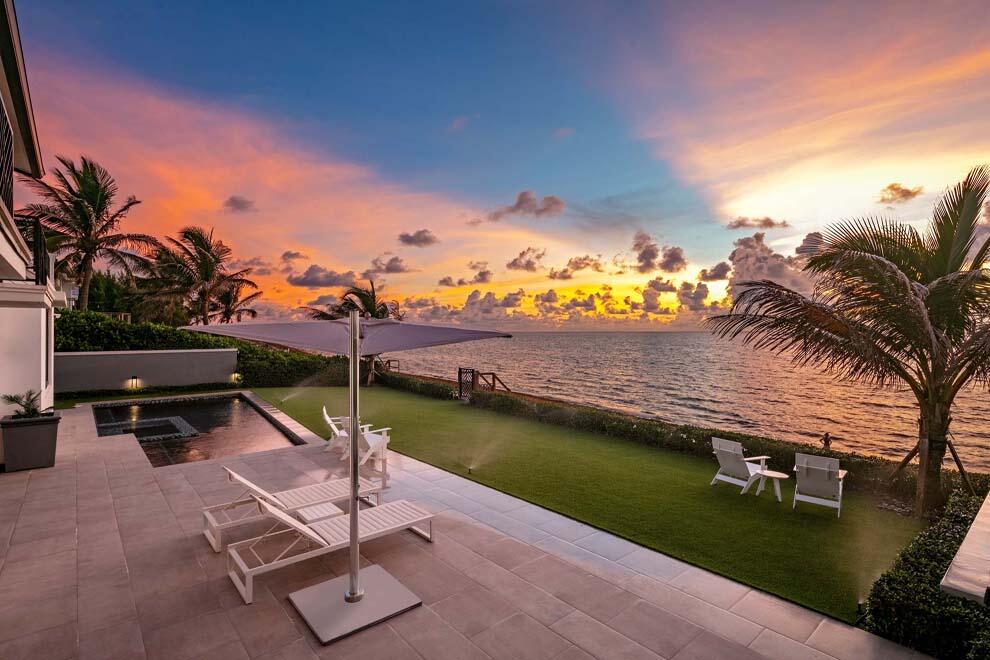 6029 Old Ocean Boulevard Ocean Ridge, FL 33435 - Photo 4 of 13 a view of a swimming pool with lounge chairs