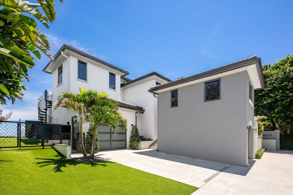 6029 Old Ocean Boulevard Ocean Ridge, FL 33435 - Photo 10 of 13 a house with swimming pool in front of it