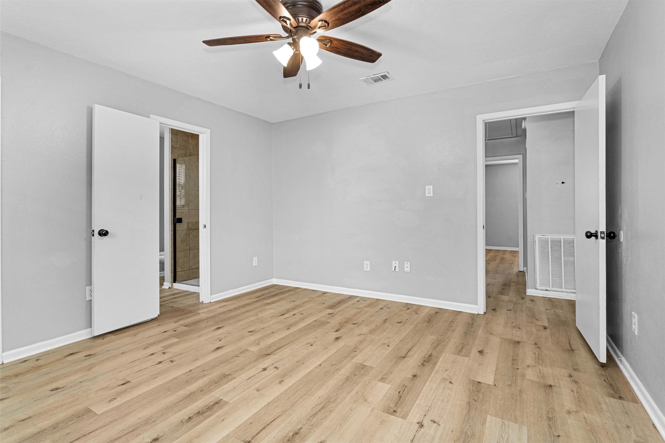4655 Old Anderson Lane Conroe, TX 77304 - Photo 11 of 23 wooden floor in an empty room with a window