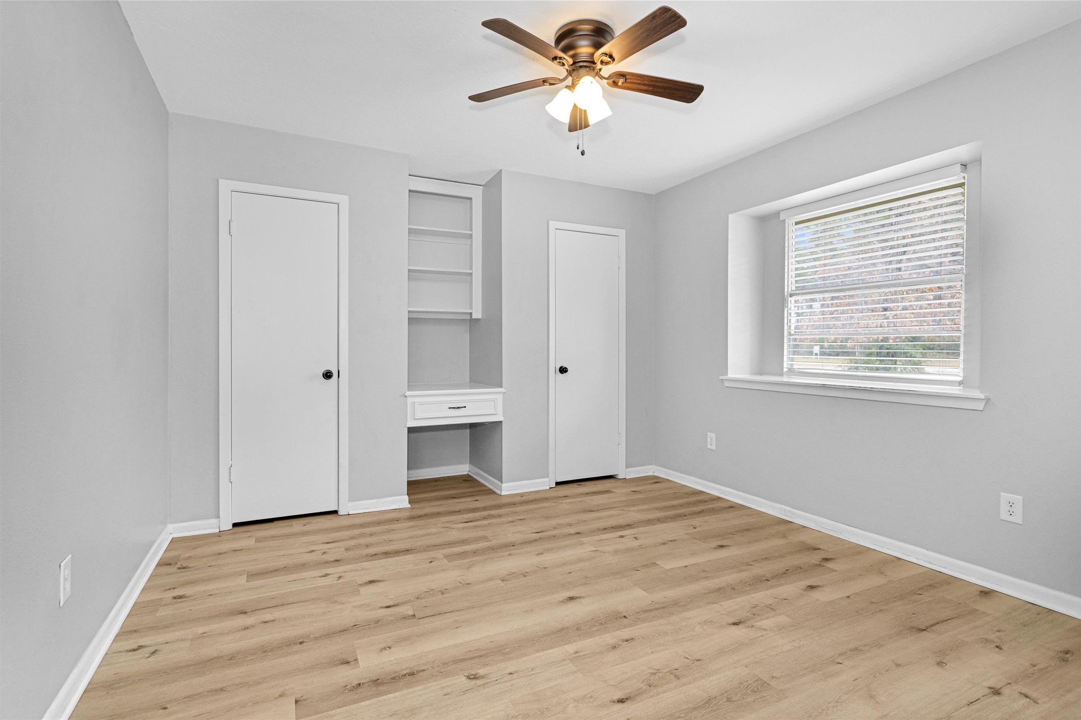 4655 Old Anderson Lane Conroe, TX 77304 - Photo 18 of 23 a view of empty room with wooden floor and fan