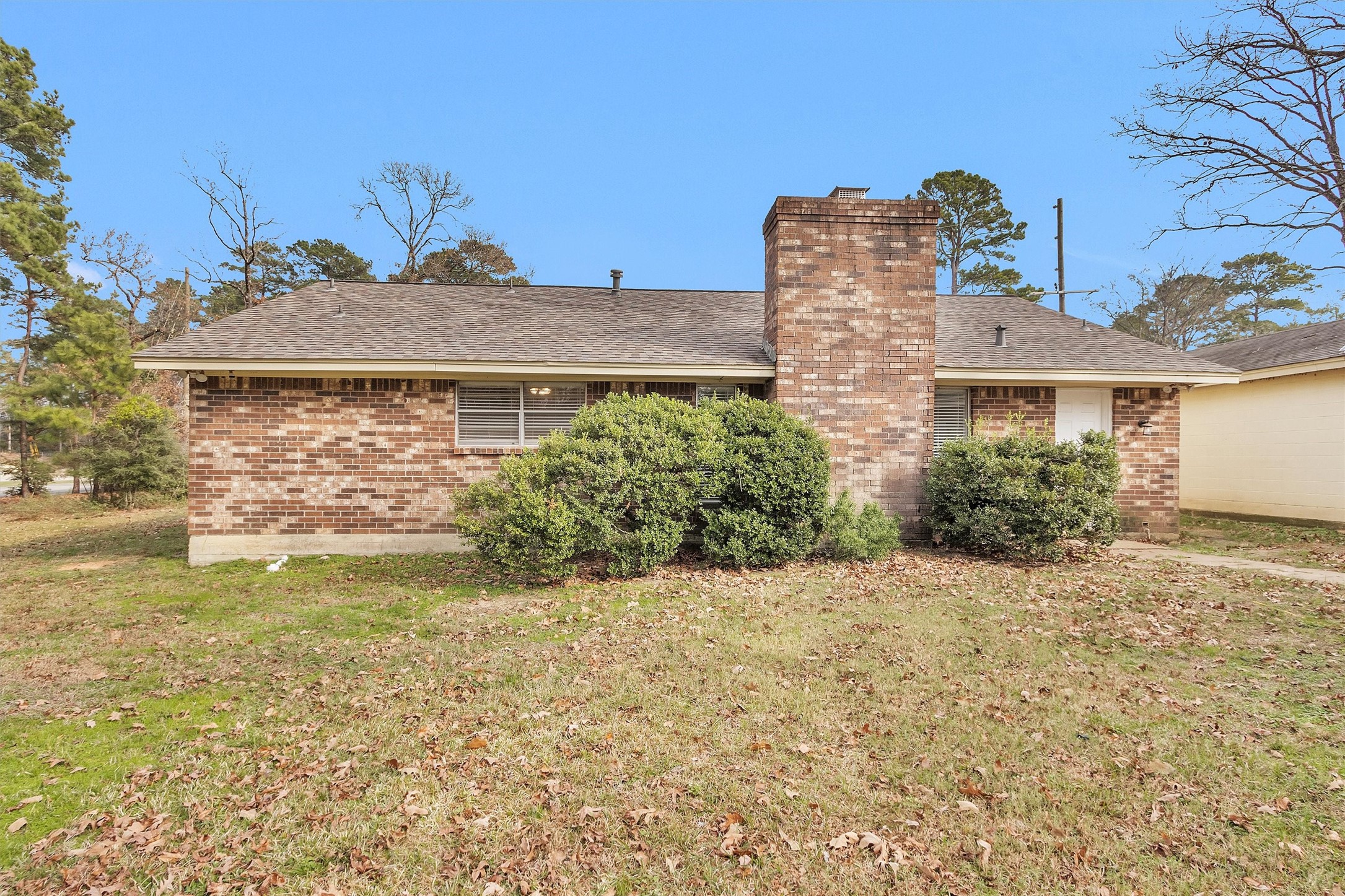 4655 Old Anderson Lane Conroe, TX 77304 - Photo 20 of 23 a front view of a house with garden