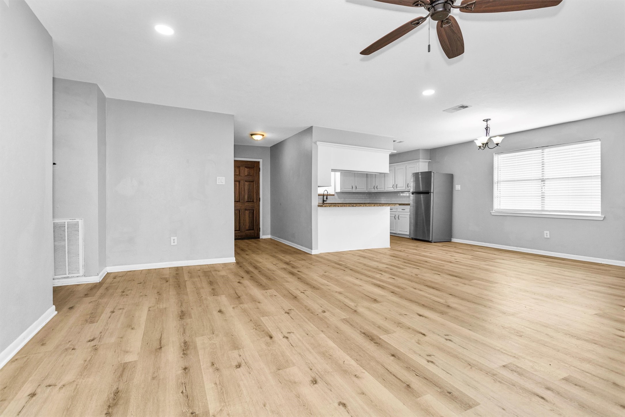 4655 Old Anderson Lane Conroe, TX 77304 - Photo 4 of 23 a view of empty room with wooden floor and window