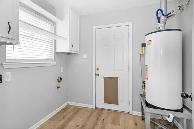 a view of an entryway with wooden floor