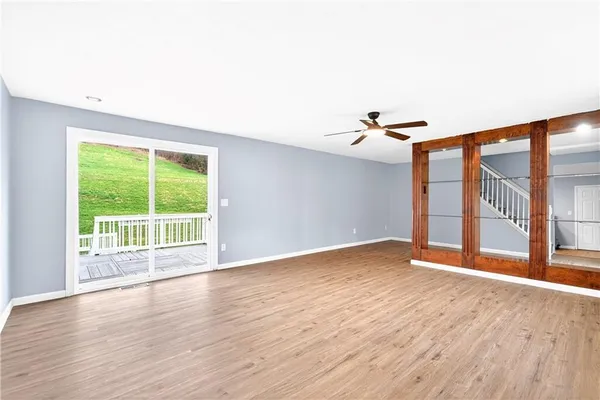 a view of an empty room with a window