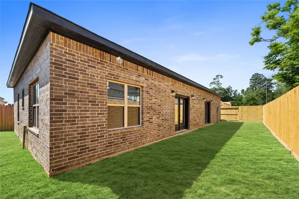 a backyard of a house with lots of green space