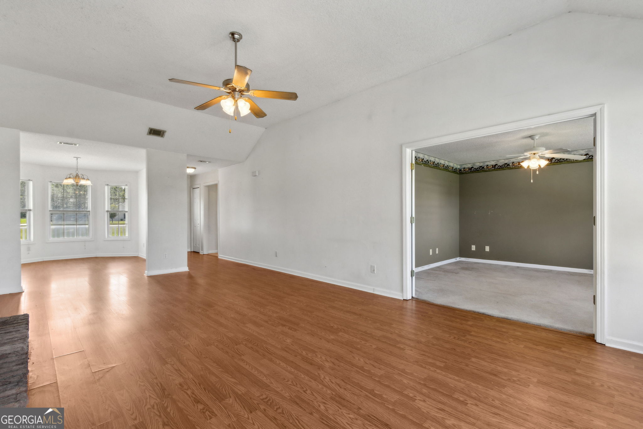 77 Thoroughbred Road Woodbine, GA 31569 - Photo 13 of 73 wooden floor in an empty room with a window