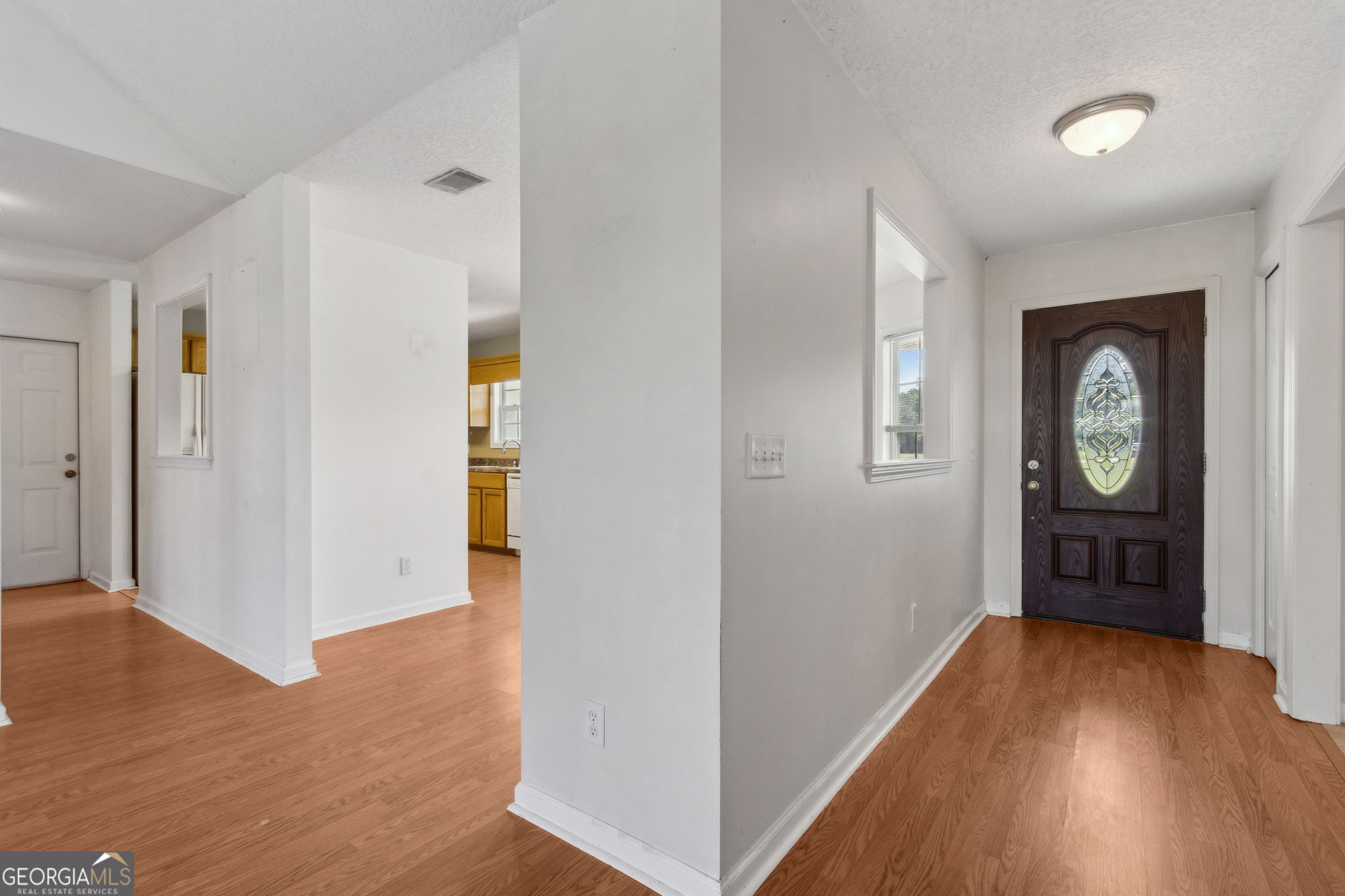 77 Thoroughbred Road Woodbine, GA 31569 - Photo 16 of 73 an empty room with wooden floor and a window